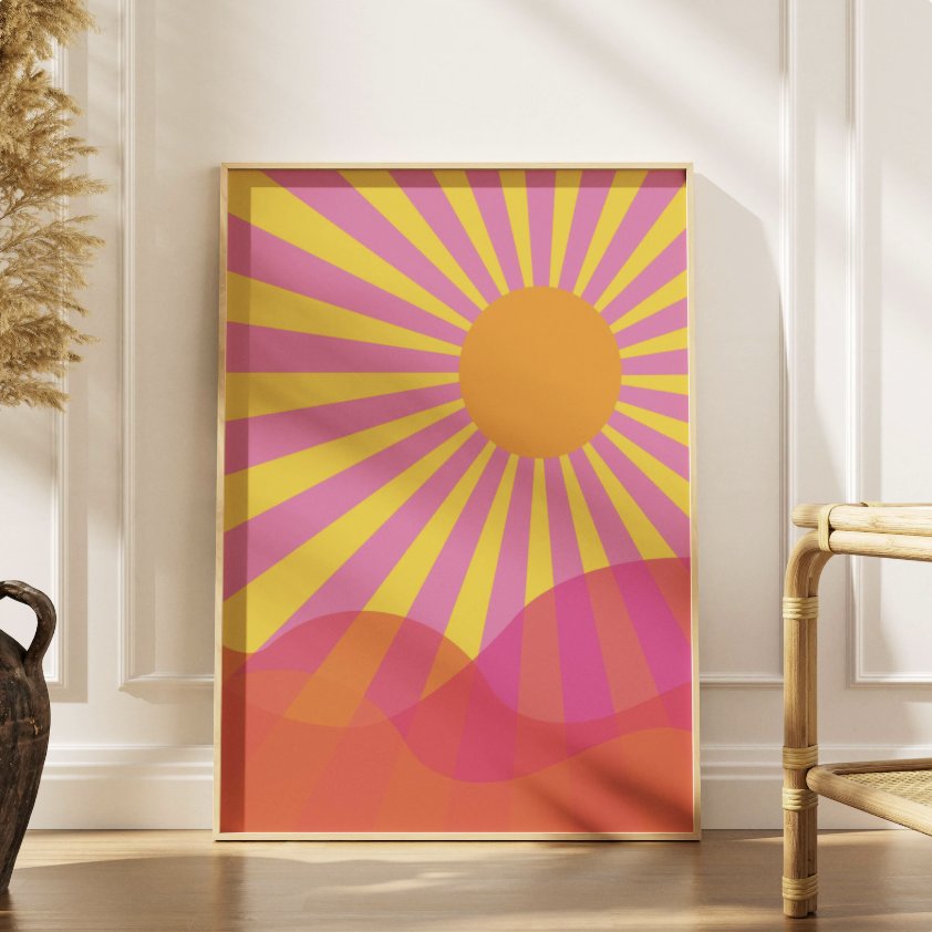 Retro sun art print, framed, with pink and yellow rays over an orange sun